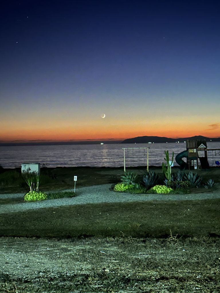 Crescent moon over the coast